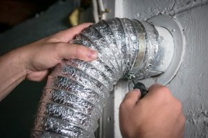 Image of a dryer vent being cleaned by Sunshine Carpet Cleaning in Port St. Lucie